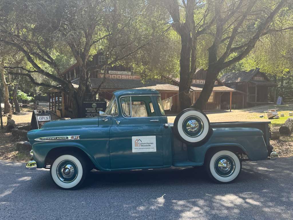 CHOW Homes vintage Chevrolet Apache truck parked at the historic Woodside Store